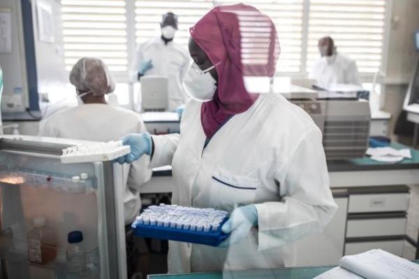 Laboratory expert carrying vaccines